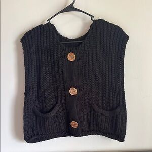 black sweater vest